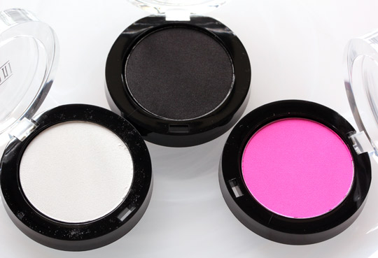 milani powder eyeshadows in white lie, pitch black and shocking pink