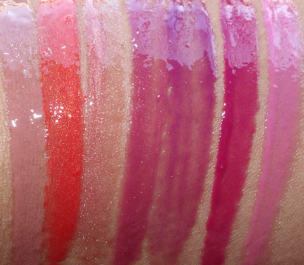 Milani Brilliant Lip Gloss Swatches from the left: Bare Secret, Mai-Tai, Luminous, Mauve Fetish, Berry Timpting, Ravish Raspberry and Pink Lady