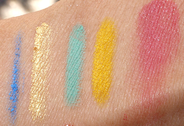 Smashbox Santigolden Age Collection swatches from the left: Double-Ended Limitless Liner in Azurite Is Never Wrong and El Dorado, Double-Ended Limitless Liner in Green Martian Yellow Dwarf and Be Legendary Lipstick Ring