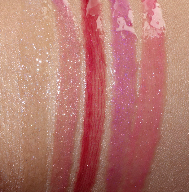 Buxom Lip Gloss Roulette swatches from the left: Full On Lip Polishes in Dominique (glittering ice), Clair (starry plum haze), Isabella (perfectly plum), Jennifer (flirty fuchsia) and Julie (juicy watermelon)