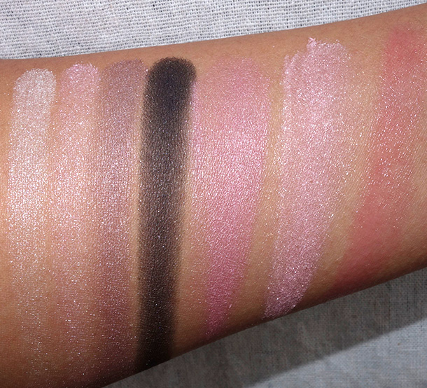Clinique Nutcracker Suite Act 1 Swatches from the left: beige, pink, taupe and black eyeshadows from the Act I compact; pink blush from the Act I compact; Snowflake Dreams Face Powder, Budding Blossom Chubby Stick Baby Tint