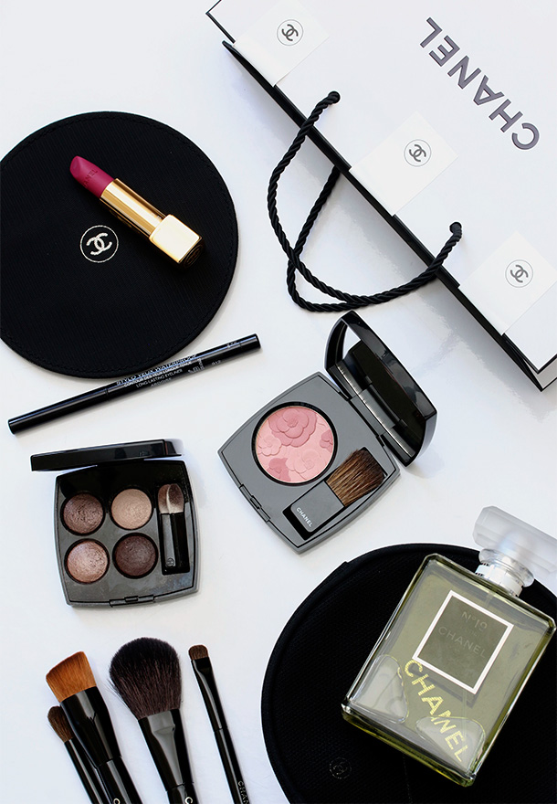 Clockwise from the upper left: Chanel Rouge Allure Velvet in La Romanesque, Stylo Yeux Waterproof Long-Lasting Eyeliner in Ardoise, Jardin de Chanel Blush Camerlia Rose, Chanel No. 19 Poudre and Les 4 Ombres Mluti-Effect Quara Eyeshadow in in Tisse Rivoli