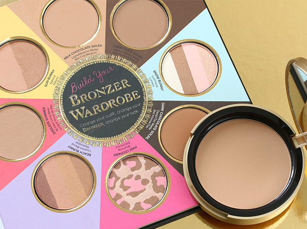 The Little Black Book of Bronzers Bronzer Collection with a full-size Too Faced Bronzer pan for scale