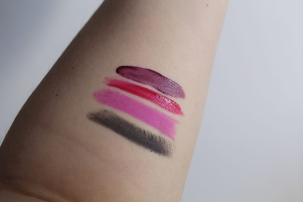 From top to bottom MAC Versicolor Lip Stain in Perpetual Holiday, Maybelline Vivid Matte Liquid Lipstick in Berry Boost, Manic Panic Lip Locked Lipstick in Mystic Heather and MAC Halsey