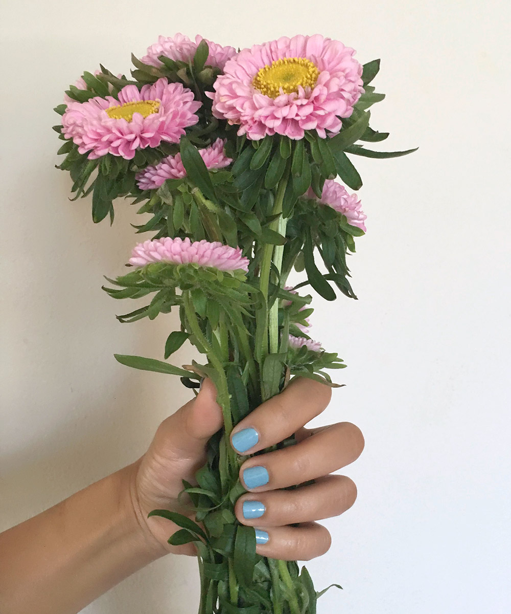 essie-first-view-holding-flowers