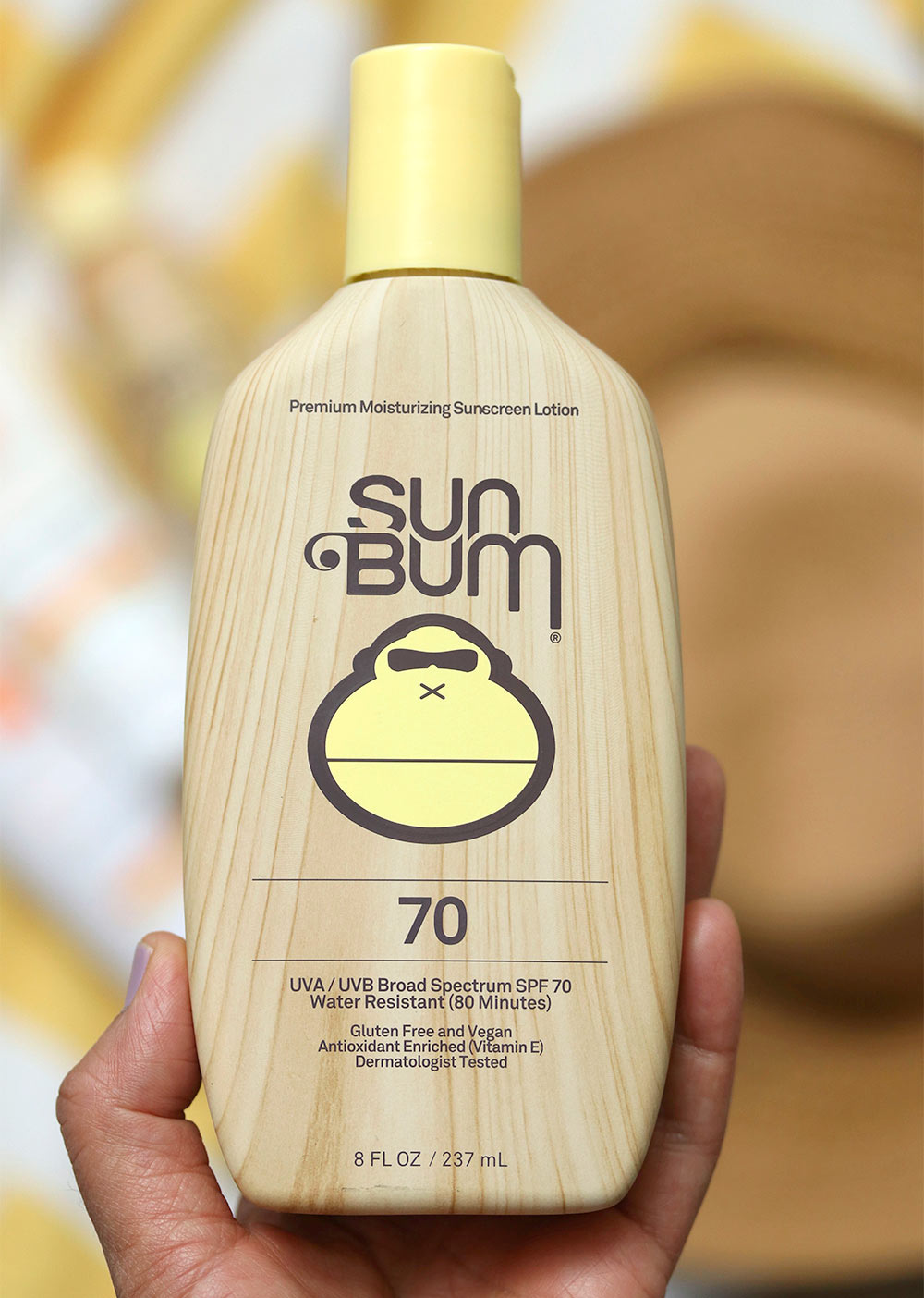 sun bum lotion in hand